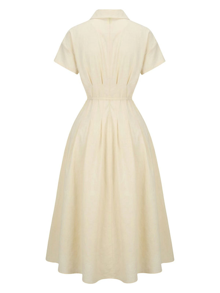 Robe jaune à col boutonné et ceinture à nouer années 1940
