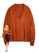Gilet orange à col en V et broderie d'étoiles années 1940