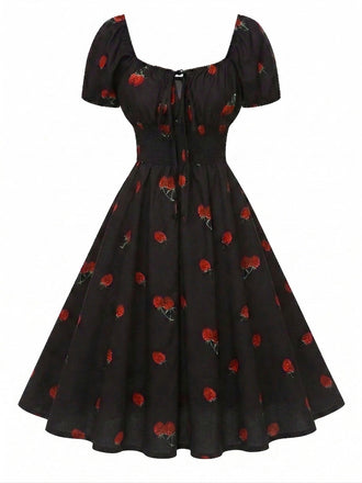 Robe noire imprimé cerises manches bouffantes années 1950