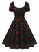 Robe noire imprimé cerises manches bouffantes années 1950