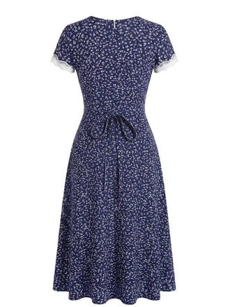 Robe bleu foncé dentelle florale et col V années 1940