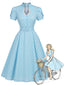 Robe bleue pois manches tulipe et décolleté goutte d'eau années 50