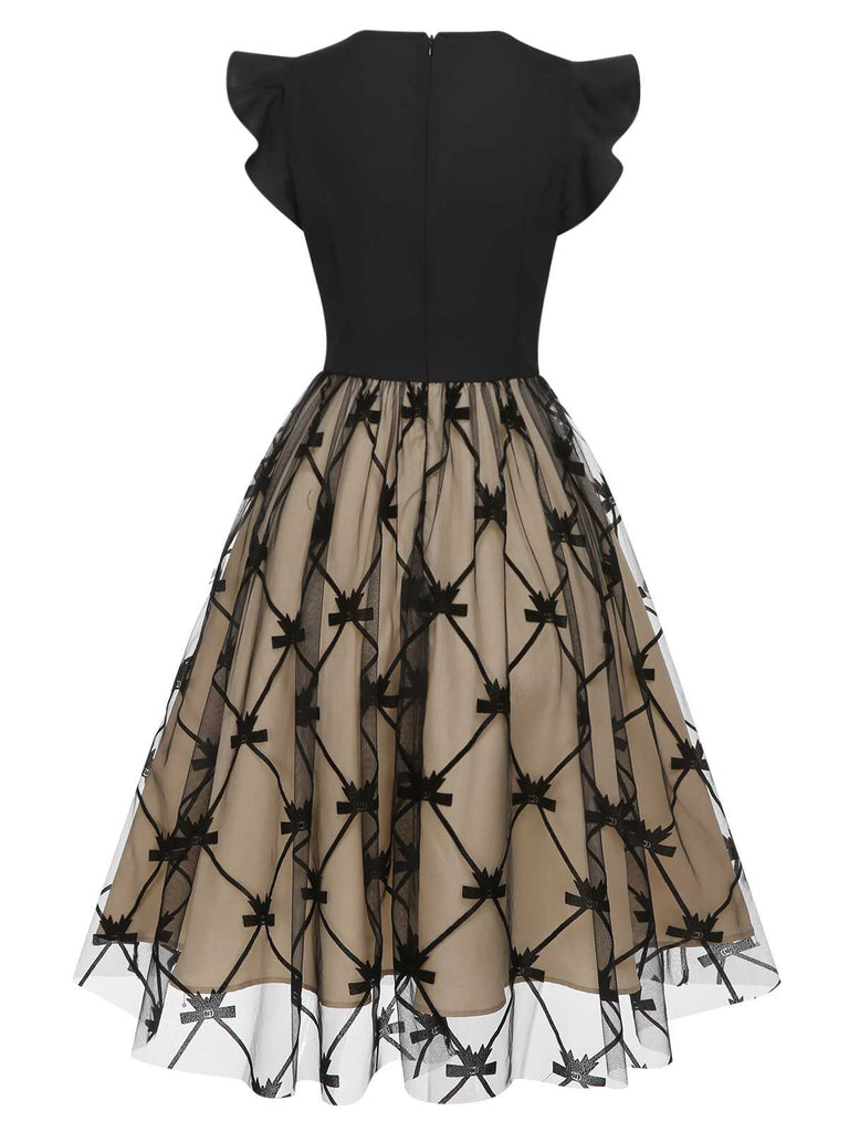 Robe noire en maille à nœud et col en V des années 1950