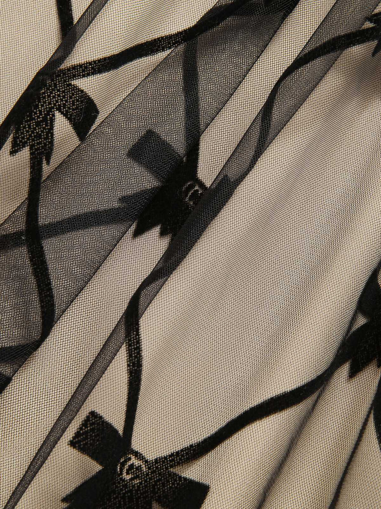 Robe noire en maille à nœud et col en V des années 1950