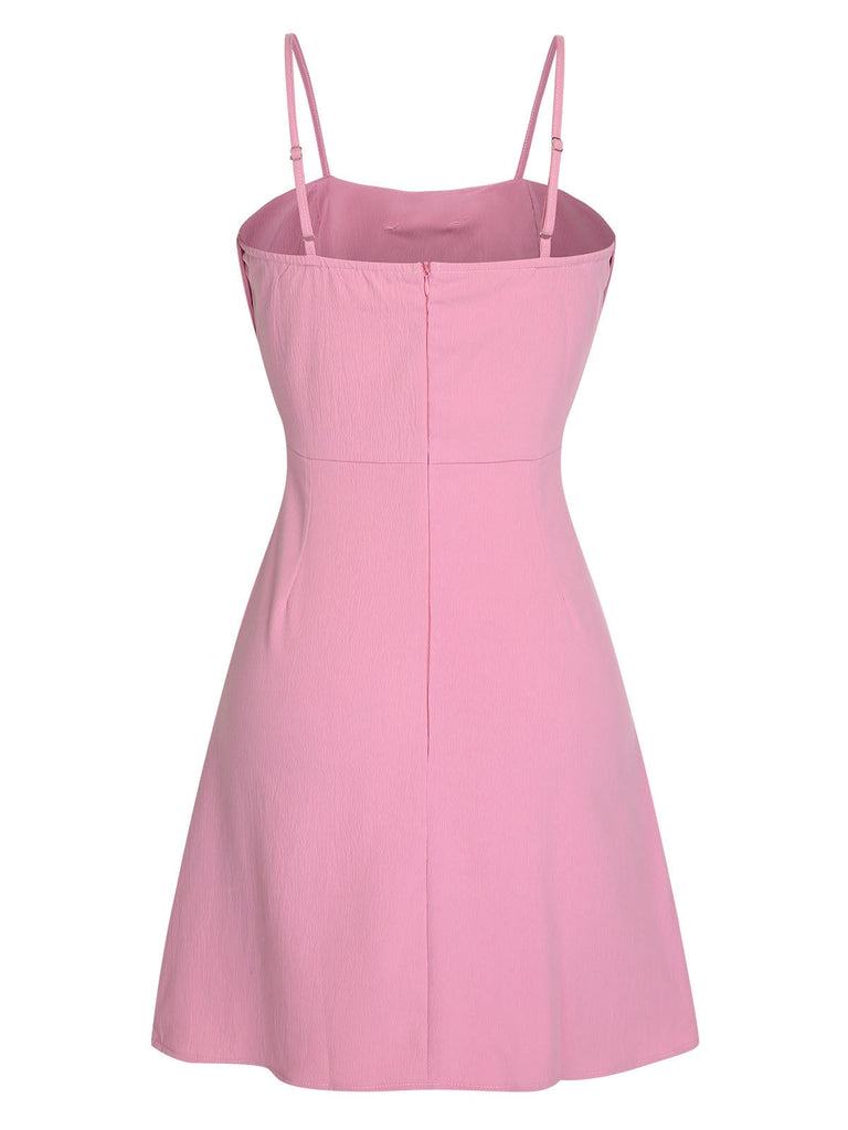 Robe rose unie à bretelles spaghetti et nœud style années 1950
