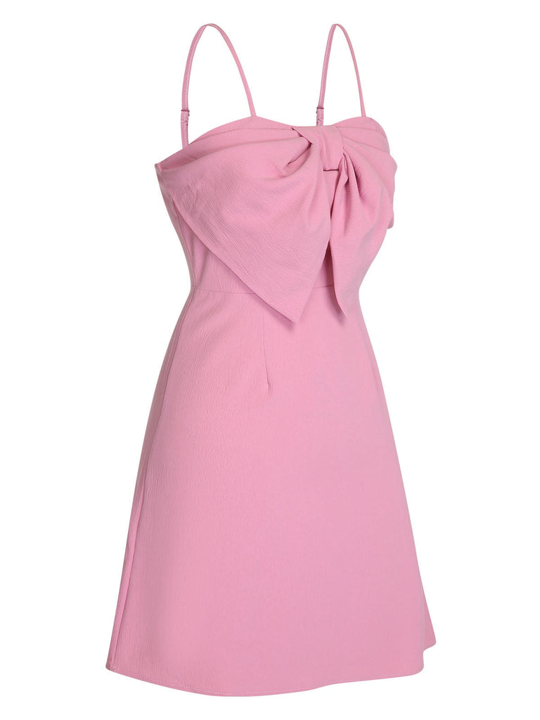 Robe rose unie à bretelles spaghetti et nœud style années 1950