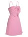 Robe rose unie à bretelles spaghetti et nœud style années 1950