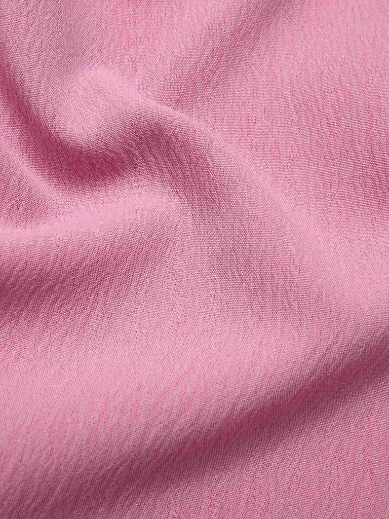 Robe rose unie à bretelles spaghetti et nœud style années 1950