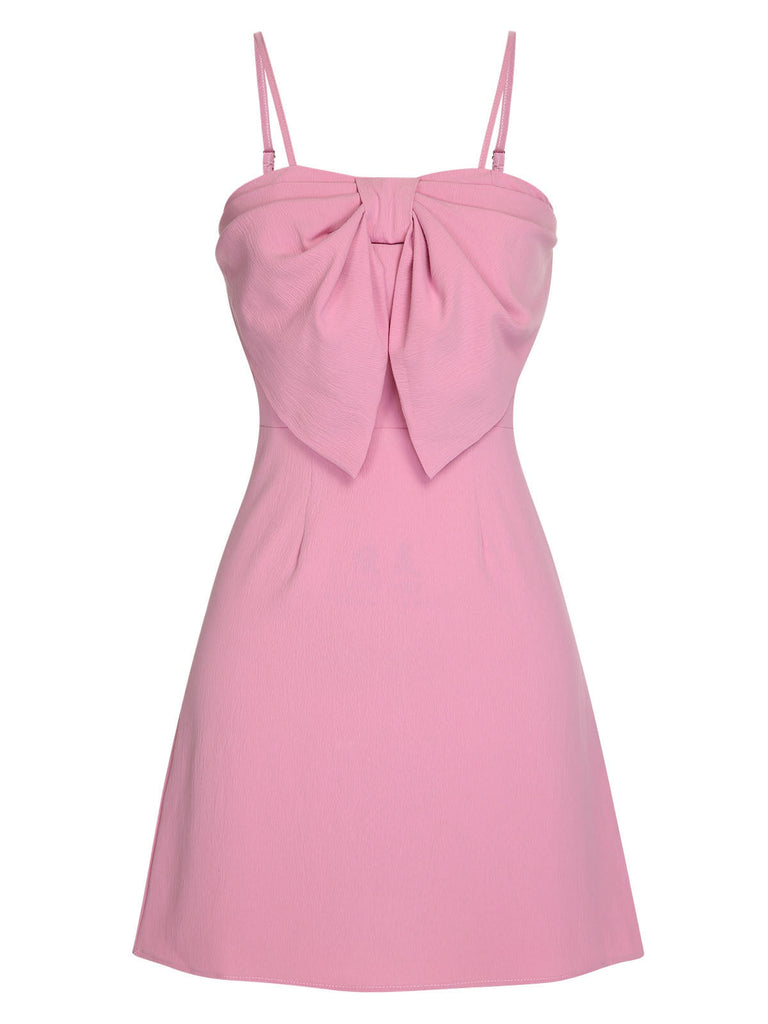 Robe rose unie à bretelles spaghetti et nœud style années 1950