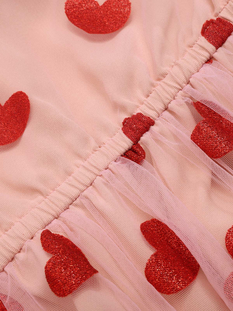 Robe en maille cœur rose à col licou des années 1950