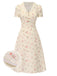 Robe beige à manches bouffantes et revers fleuris des années 1940