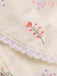 Robe beige à manches bouffantes et revers fleuris des années 1940