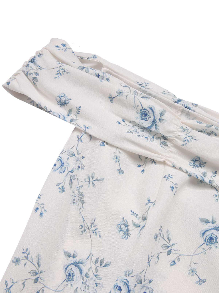 Robe bleue à volants et épaules dénudées motif floral des années 1930