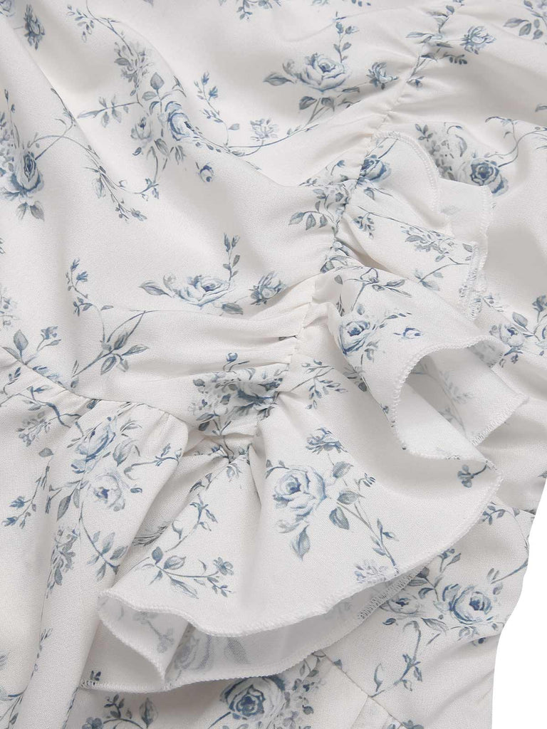Robe bleue à volants et épaules dénudées motif floral des années 1930
