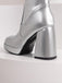 Bottes à talons hauts solides en cuir verni à bout rond