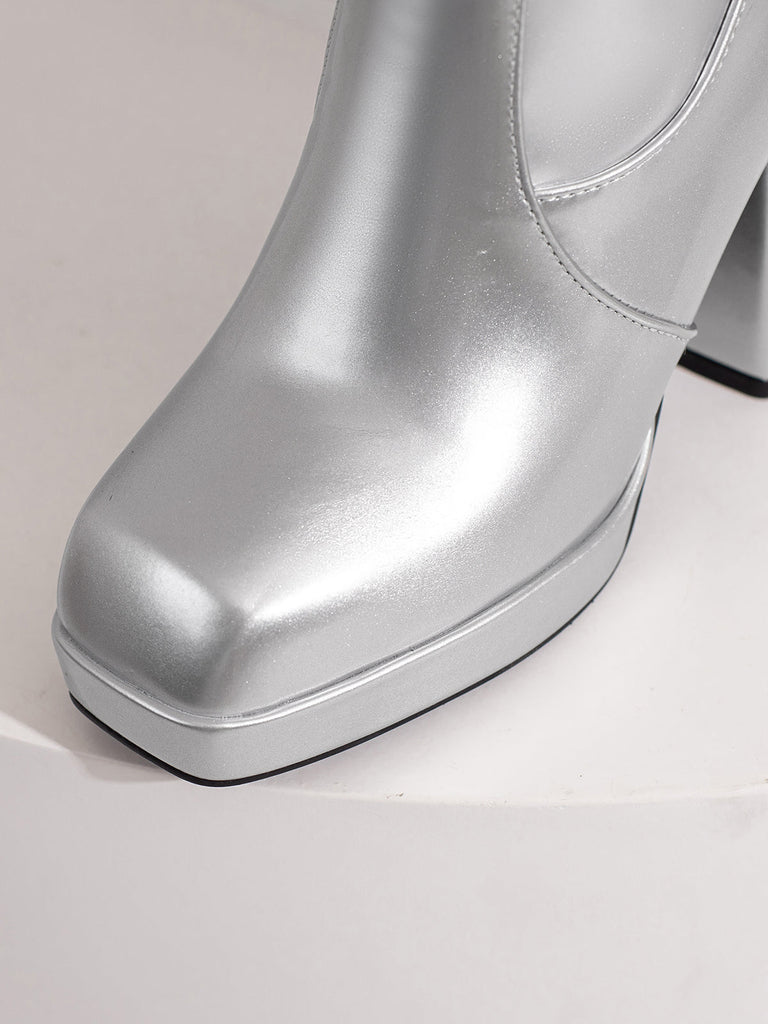 Bottes à talons hauts solides en cuir verni à bout rond