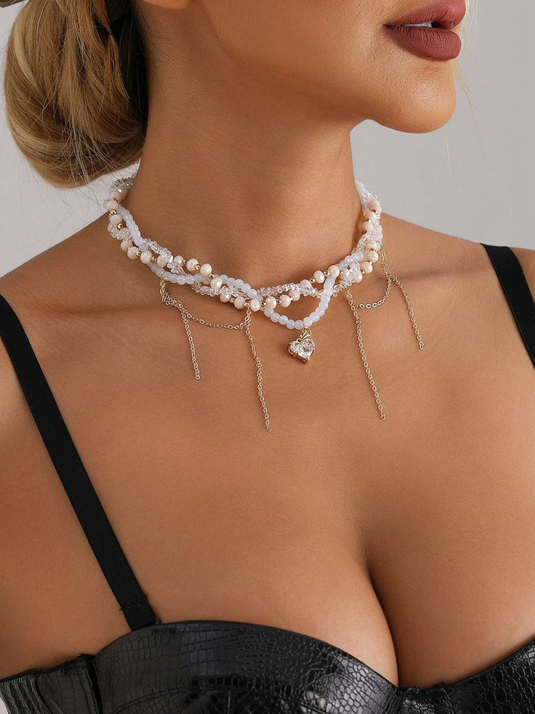 Collier de perles avec pendentif en forme de cœur blanc et strass