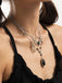 Collier gothique noir à plusieurs niveaux avec cœur ailes étoile et épée