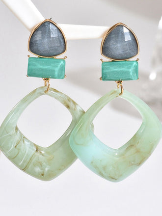 Boucles d'oreilles vintage en résine marbrée à motif géométrique exagéré