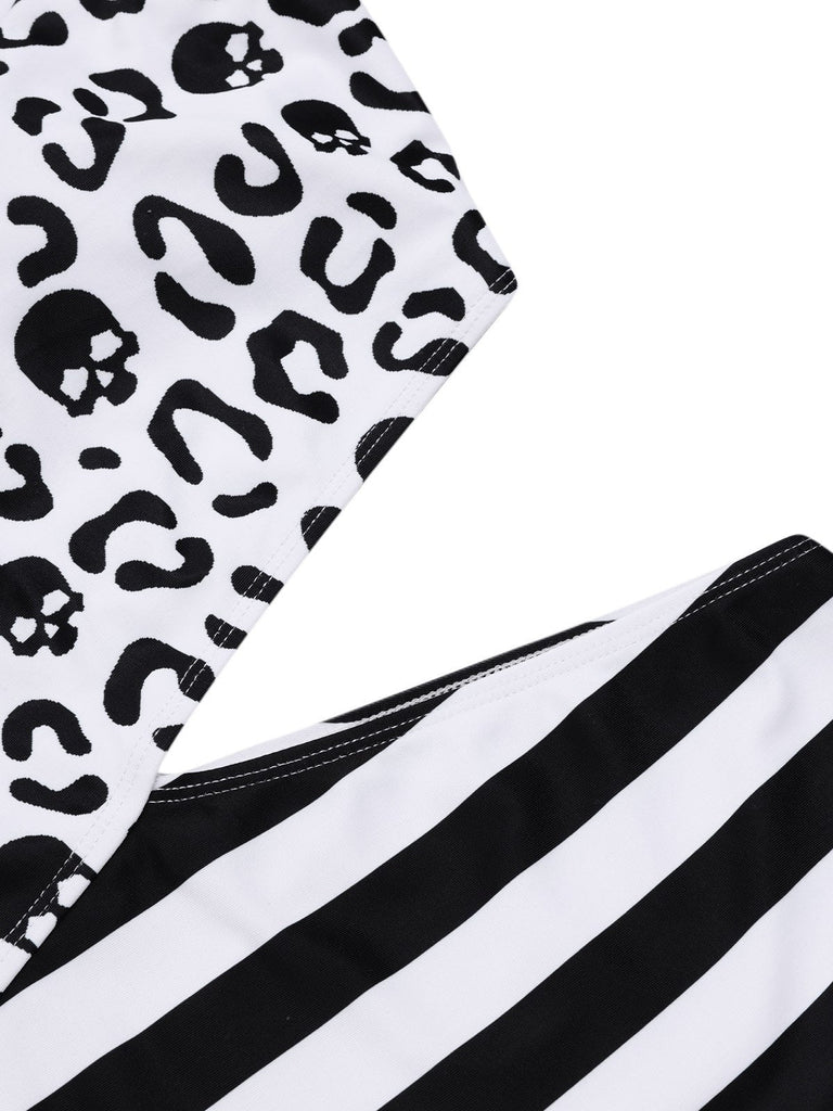 Maillot de bain noir à rayures et tête de mort une épaule ajourée années 80