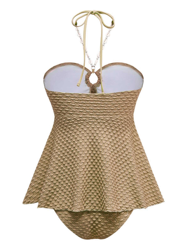 Maillot de bain dos nu à lacets et chaîne coquillages des années 1940