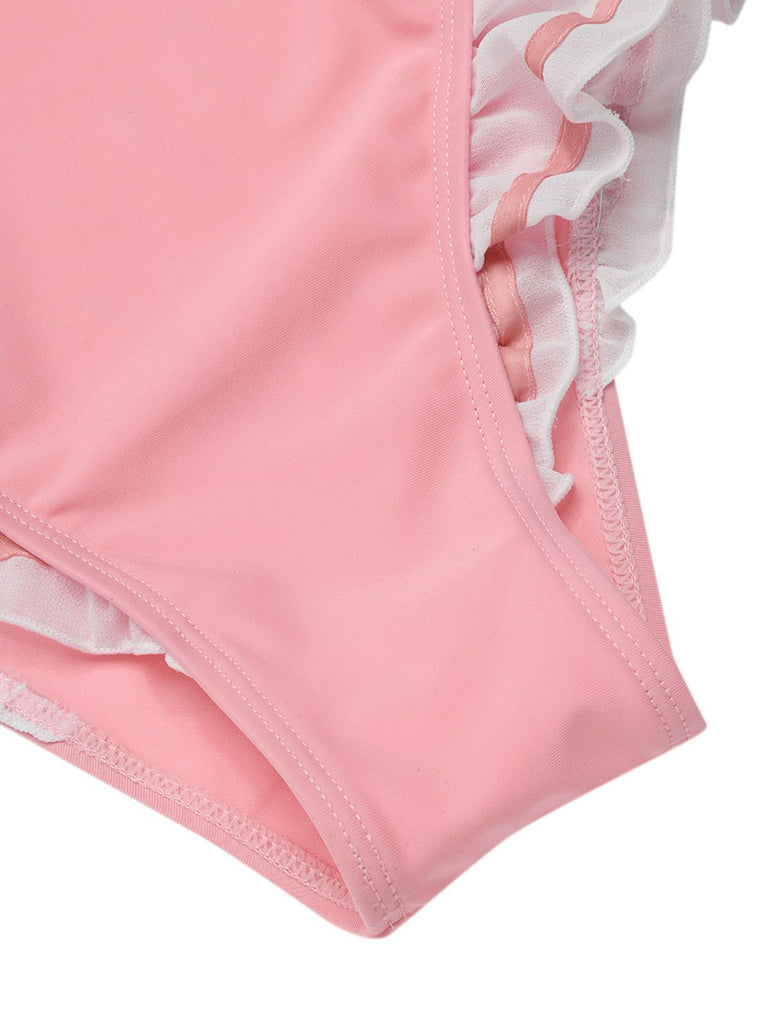 Maillot de bain une pièce rose à revers nœud papillon des années 1950