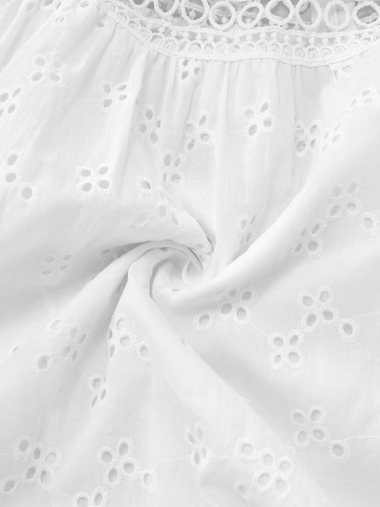 Close-up of white fabric with lace detailing