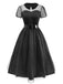 Robe noire en tulle transparent col Claudine et ceinture des années 1940