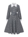 Robe noire à manches bouffantes et boutons nacrés style pied-de-poule années 1940