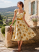Robe orange motif tournesols et encolure cœur années 50