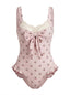 Maillot de bain une pièce rose en dentelle nœud cerise années 1950